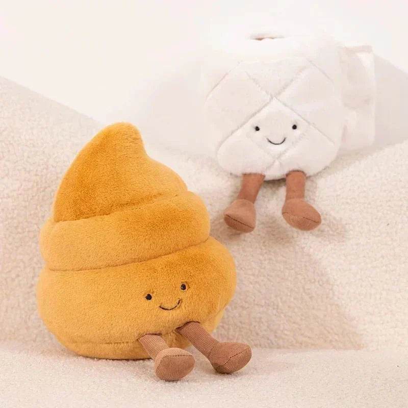 Plush toy resembling a smiling poop emoji on a soft white background